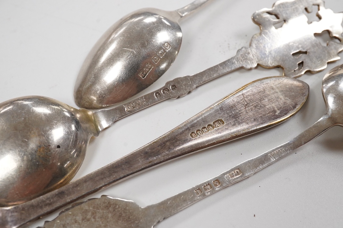 A small group of silver including an Edwardian miniature model of a throne by Edward Foligne Braham, Birmingham, 1901, 50mm, a small comport, one part of a belt buckle and three commemorative spoons, together with a gilt
